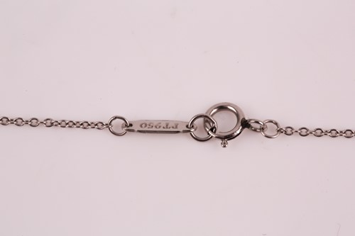 Lot 231 - A Tiffany enchanted key pendant; the diamond...