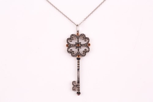 Lot 231 - A Tiffany enchanted key pendant; the diamond...