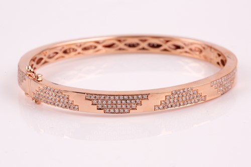 Lot 348 - An 18ct rose gold and diamond bracelet; the...