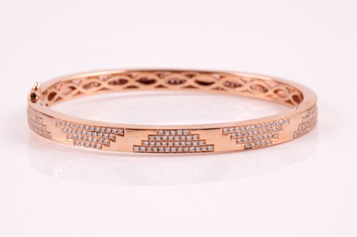 Lot 348 - An 18ct rose gold and diamond bracelet; the...