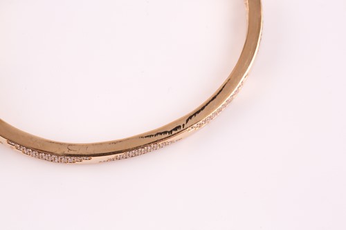 Lot 220 - An 18ct yellow gold and diamond bracelet; the...