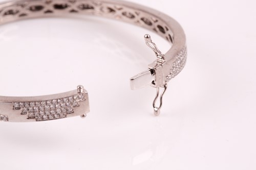Lot 197 - An 18ct white gold and diamond bracelet; the...