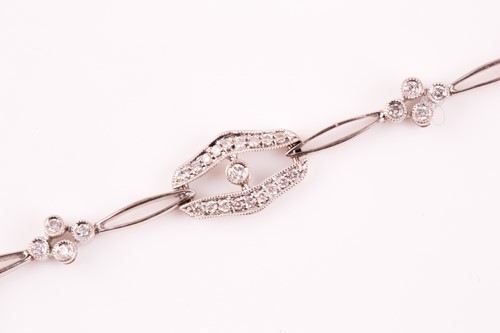Lot 37 - A diamond bracelet; of alternating diamond set...