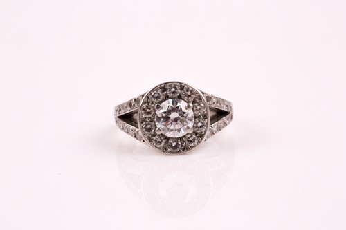 Lot 19 - A diamond cluster ring, the central brilliant...
