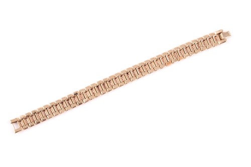 Lot 299 - A diamond bracelet, three rows of fluted links,...
