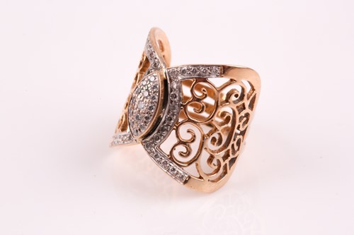 Lot 300 - A diamond dress ring; the central scroll...