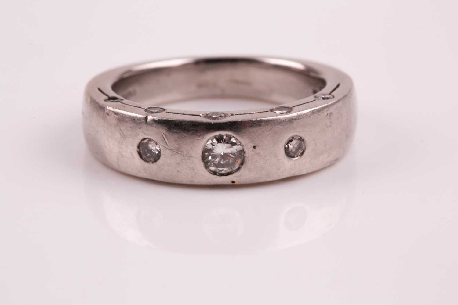 Lot 73 - A gentleman's diamond and platinum ring; the...