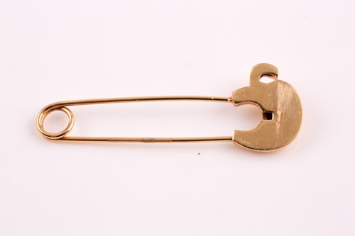 Lot 190 - A safety pin brooch, the terminal set with an...