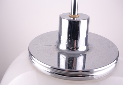 Lot 325 - A Harvey Guzzini chrome and plastic table lamp,...