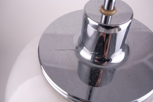 Lot 325 - A Harvey Guzzini chrome and plastic table lamp,...