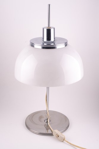 Lot 325 - A Harvey Guzzini chrome and plastic table lamp,...