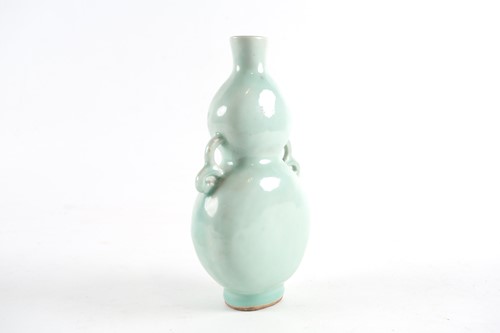 Lot 166 - A Chinese celadon gourd vase, Qing, 18th/19th...