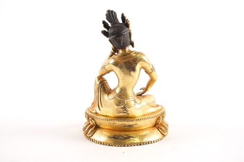 Lot 179 - A Sino Tibetan gilt-bronze figure of Tara...
