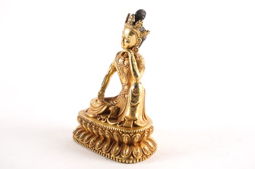 Lot 179 - A Sino Tibetan gilt-bronze figure of Tara...