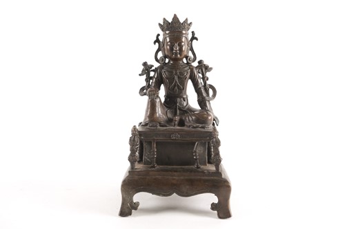 Lot 180 - A Chinese patinated bronze figure of a Tara...