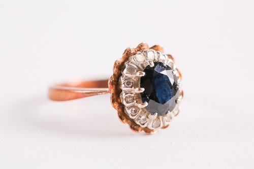 Lot 103 - An 18ct yellow gold, sapphire, and white stone...