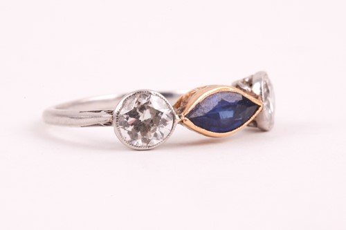 Lot 362 - A diamond and blue stone ring, collet-set east...