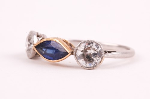 Lot 362 - A diamond and blue stone ring, collet-set east...