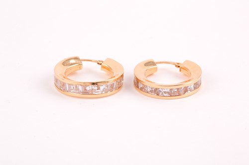 Lot 112 - A pair of yellow metal and cubic zirconia hoop...