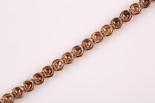 Lot 306 - A 9ct yellow gold and diamond line bracelet,...