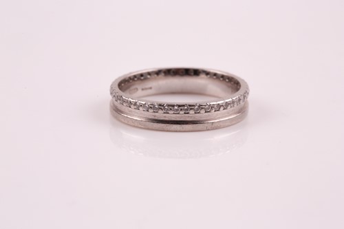 Lot 249 - A platinum and diamond ring; set as a full...