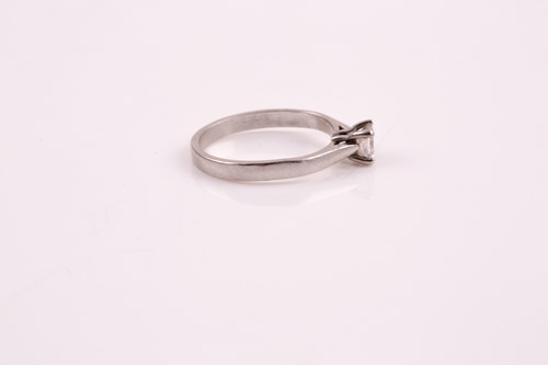Lot 330 - A single stone diamond ring, the princess cut...