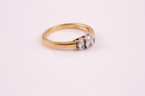 Lot 243 - A three stone half hoop diamond ring, the...