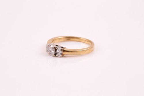Lot 243 - A three stone half hoop diamond ring, the...