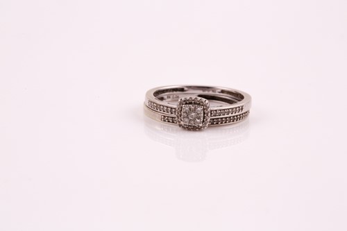 Lot 152 - A diamond cluster ring, the central cushion...