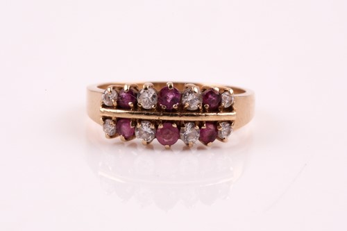 Lot 207 - A ruby and diamond two row, half hoop ring,...