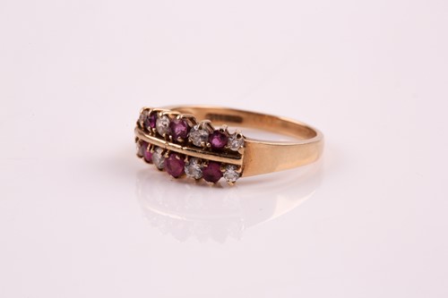 Lot 207 - A ruby and diamond two row, half hoop ring,...