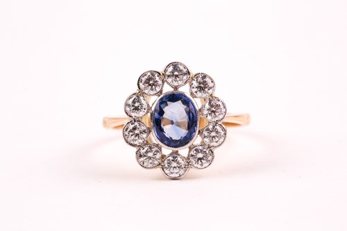 Lot 82 - A diamond and sapphire ring, collet-set with a...