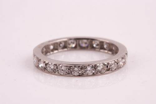 Lot 342 - A diamond full eternity ring, set with round...