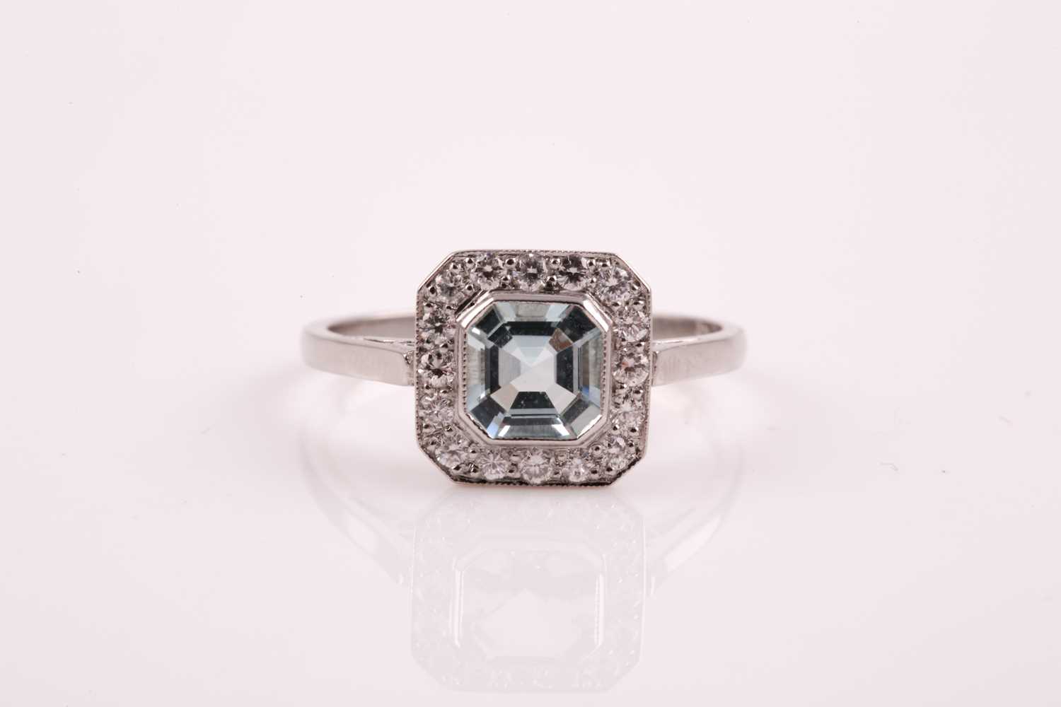 Lot 20 - A platinum, diamond, and aquamarine ring, set...
