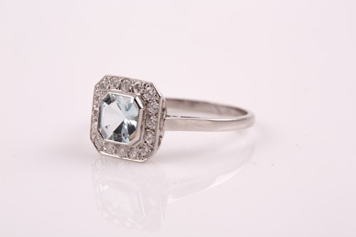 Lot 20 - A platinum, diamond, and aquamarine ring, set...