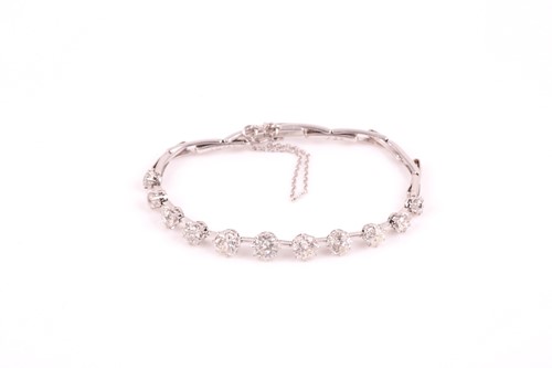 Lot 295 - A platinum and diamond bracelet, set with...