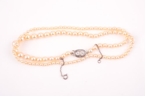 Lot 222 - A graduated cultured pearl necklace, the clasp...