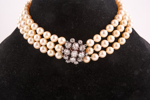 Lot 494 - A triple strand pearl choker necklace,...