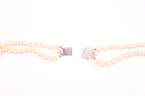 Lot 109 - A double strand pearl necklace, set with a...