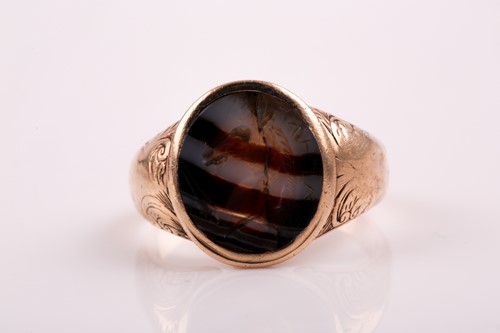 Lot 322 - A 19th century agate signet ring; the oval...