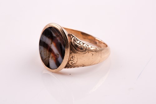 Lot 322 - A 19th century agate signet ring; the oval...