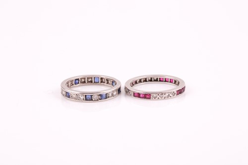 Lot 204 - A diamond and sapphire eternity ring, set with...