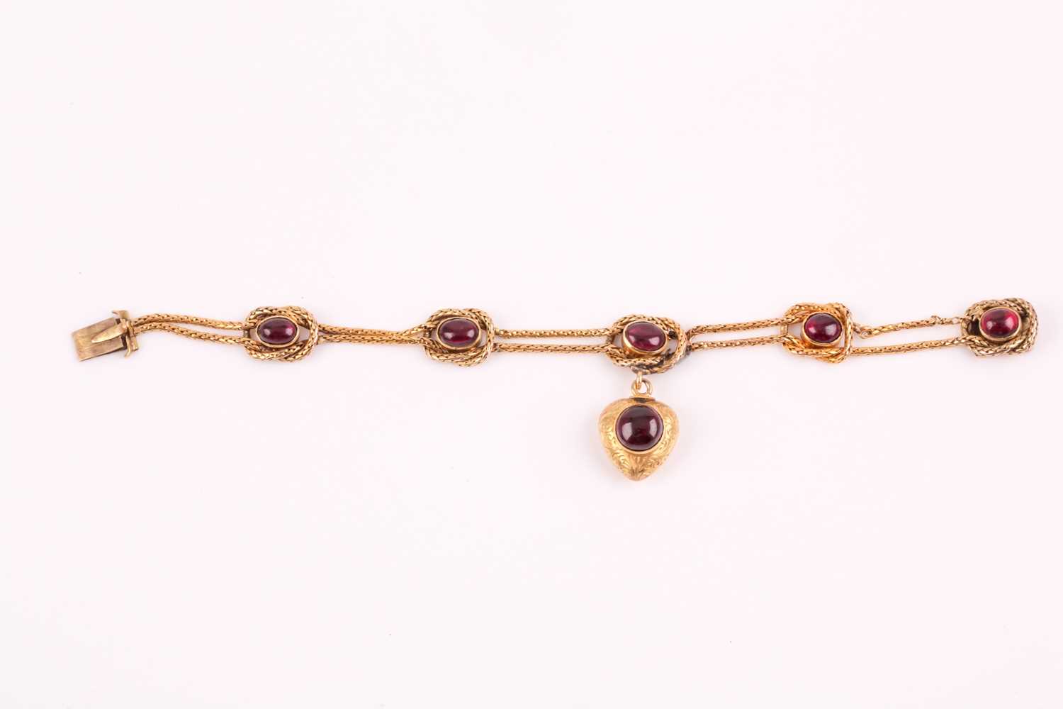 Lot 349 - A Victorian yellow gold and cabochon garnet...