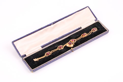 Lot 349 - A Victorian yellow gold and cabochon garnet...
