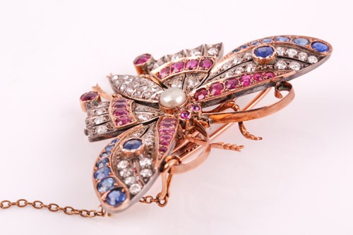 Lot 282 - A diamond, ruby, and sapphire butterfly brooch,...