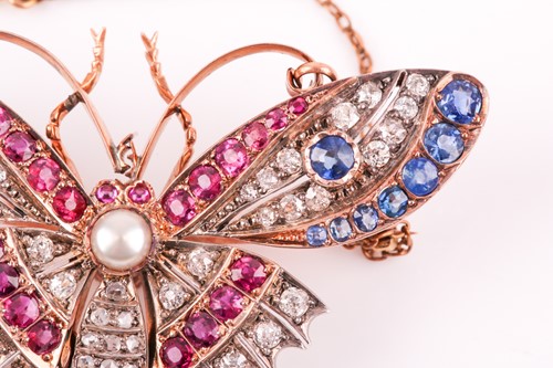 Lot 282 - A diamond, ruby, and sapphire butterfly brooch,...