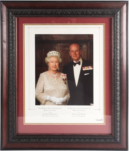Lot 472 - A framed photographic print of HM Queen...