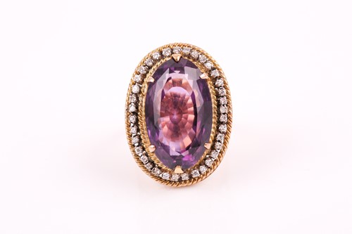 Lot 299 - An 18ct yellow gold, diamond, and amethyst...