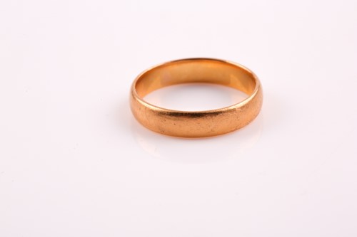 Lot 361 - A plain 22ct gold wedding band. Size P, 5.3 grams