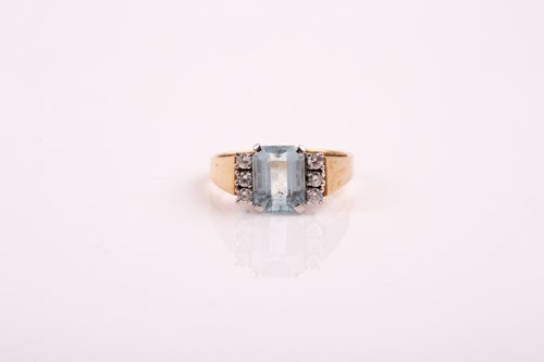 Lot 24 - An aquamarine and diamond ring; the step cut...